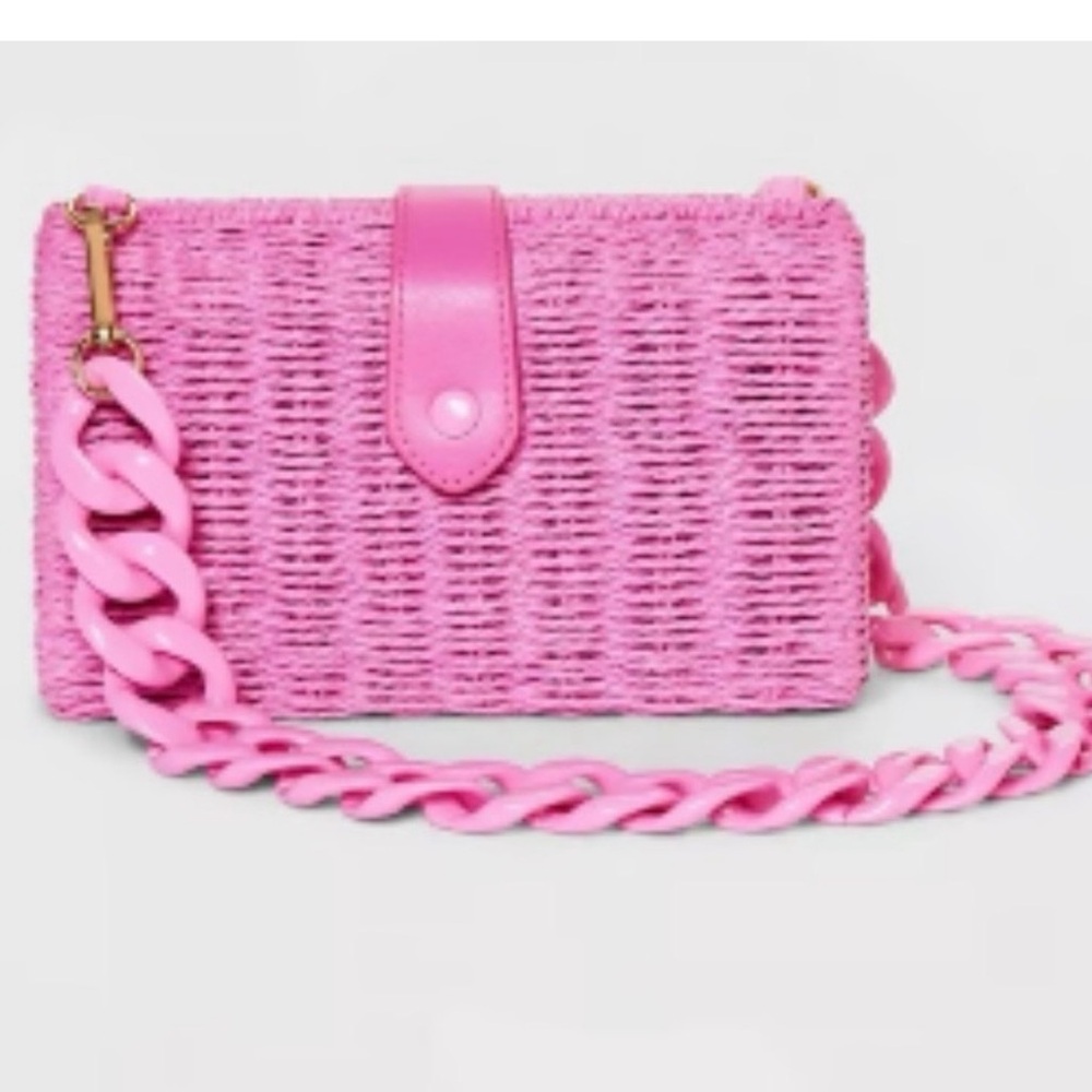 a new day Pink rattan clutch with resin chain strap and snap closure 
Like new